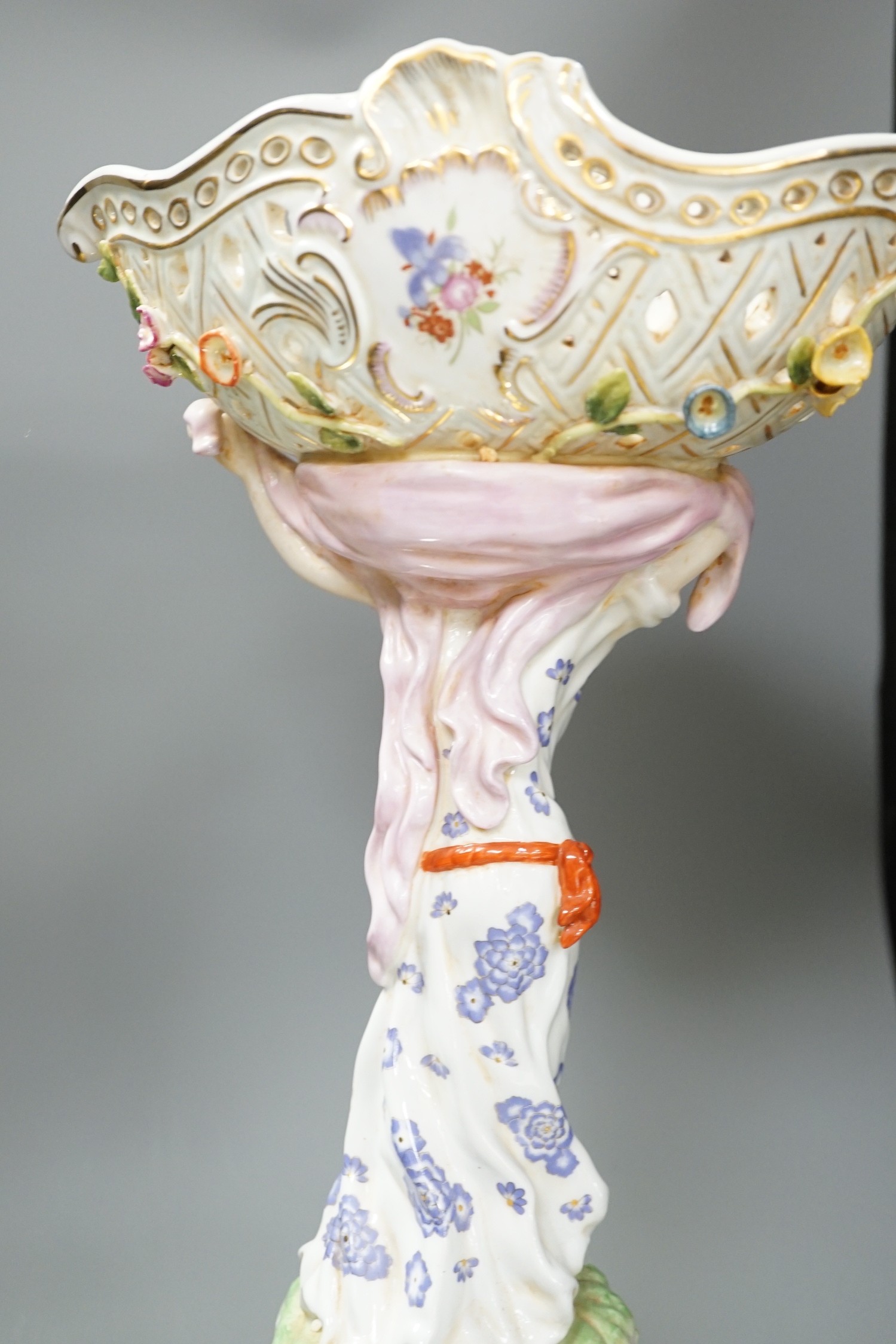 A German floral encrusted porcelain centrepiece and similar easel mirror, tallest 46cm